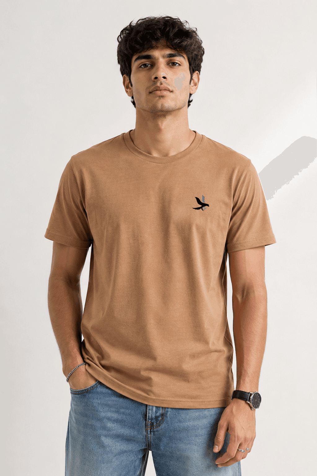 Model wearing the Beige Signature Eagle regular-fit T-shirt, front view with the eagle chest mark