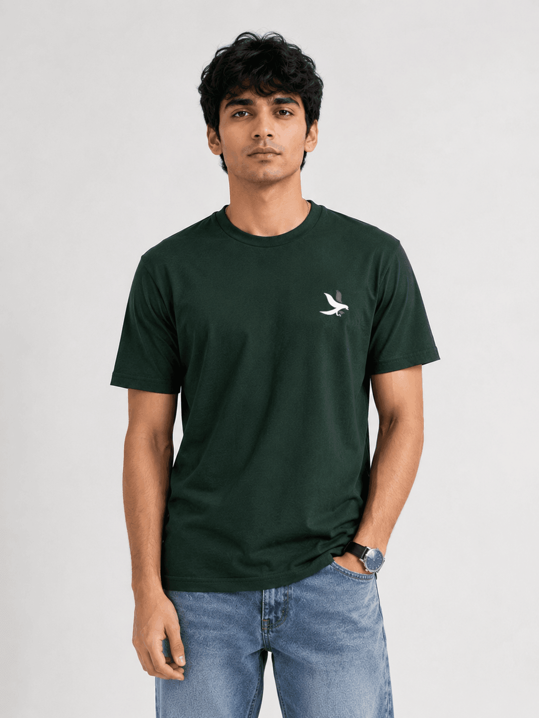 Model wearing the Bottle Green Signature Eagle regular-fit T-shirt, front view with the eagle chest mark