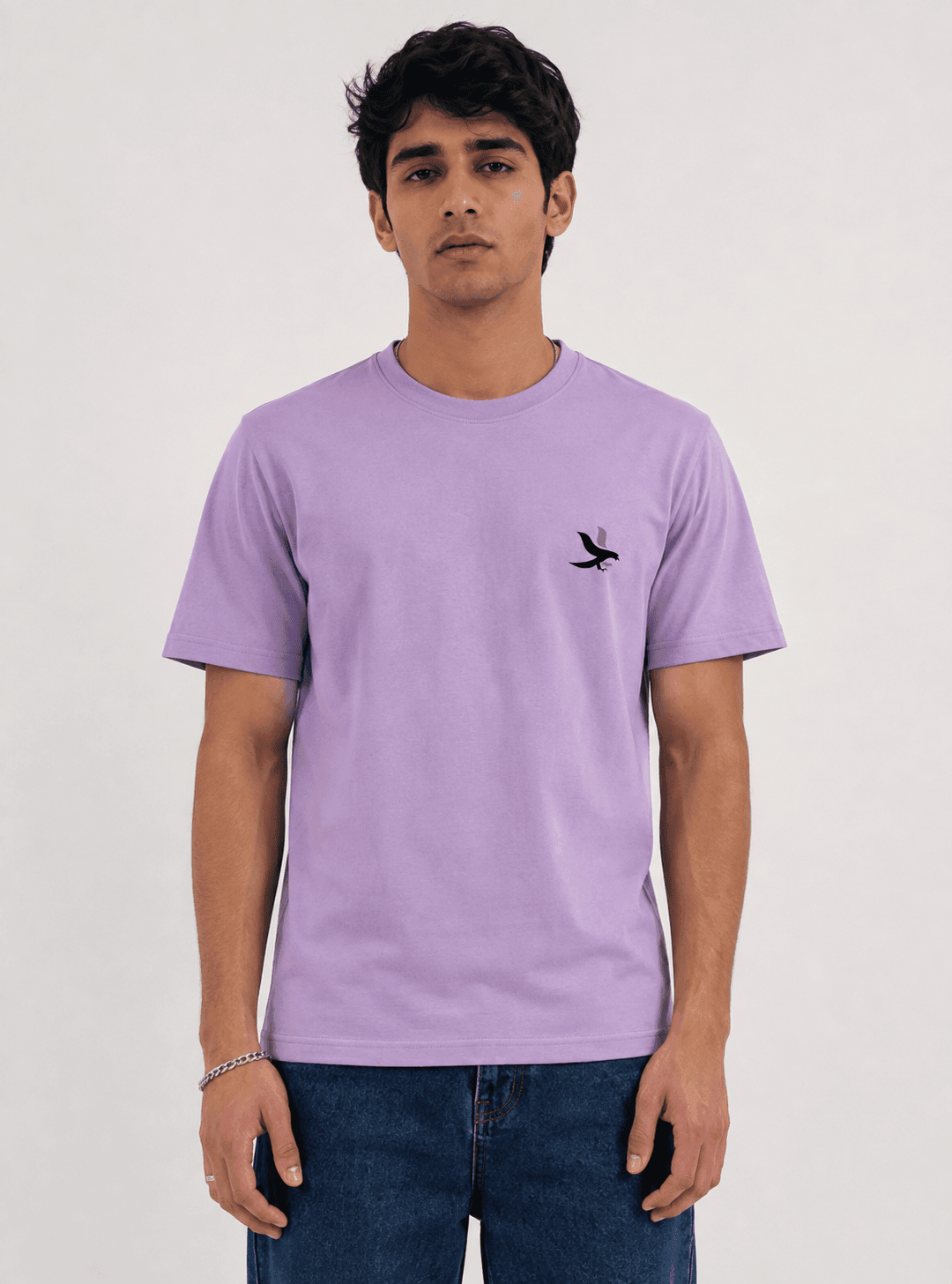 Model wearing the Lavender Signature Eagle regular-fit T-shirt, front view with the eagle chest mark