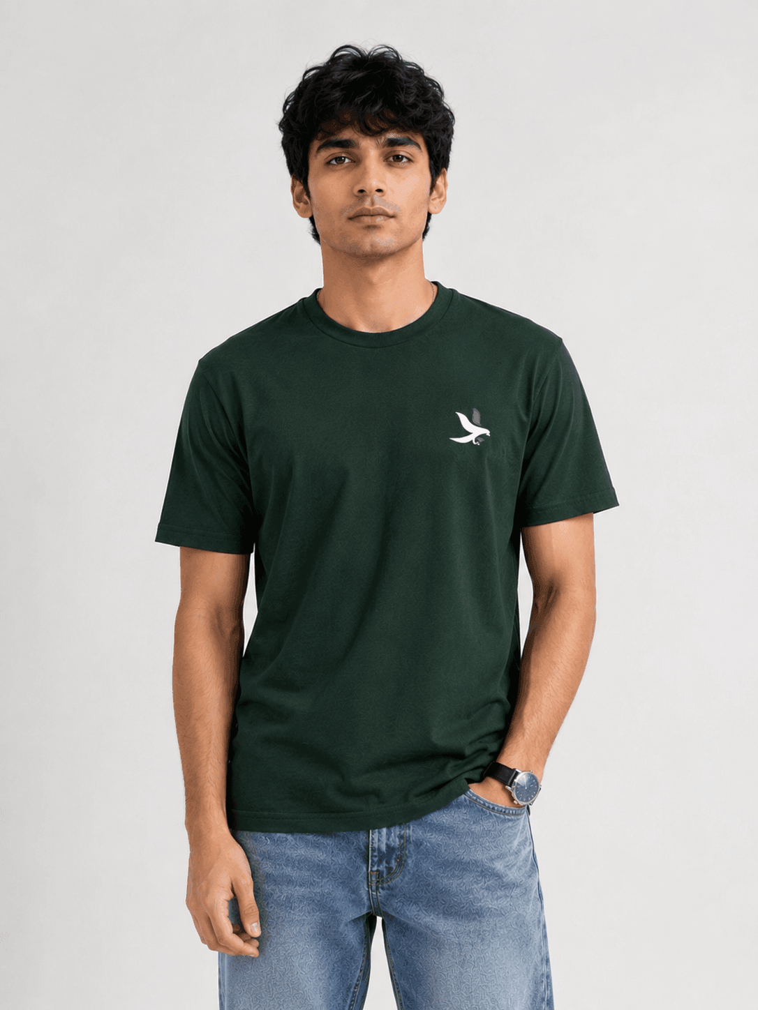 Model wearing the Bottle Green Signature Eagle regular-fit T-shirt, front view with the eagle chest mark