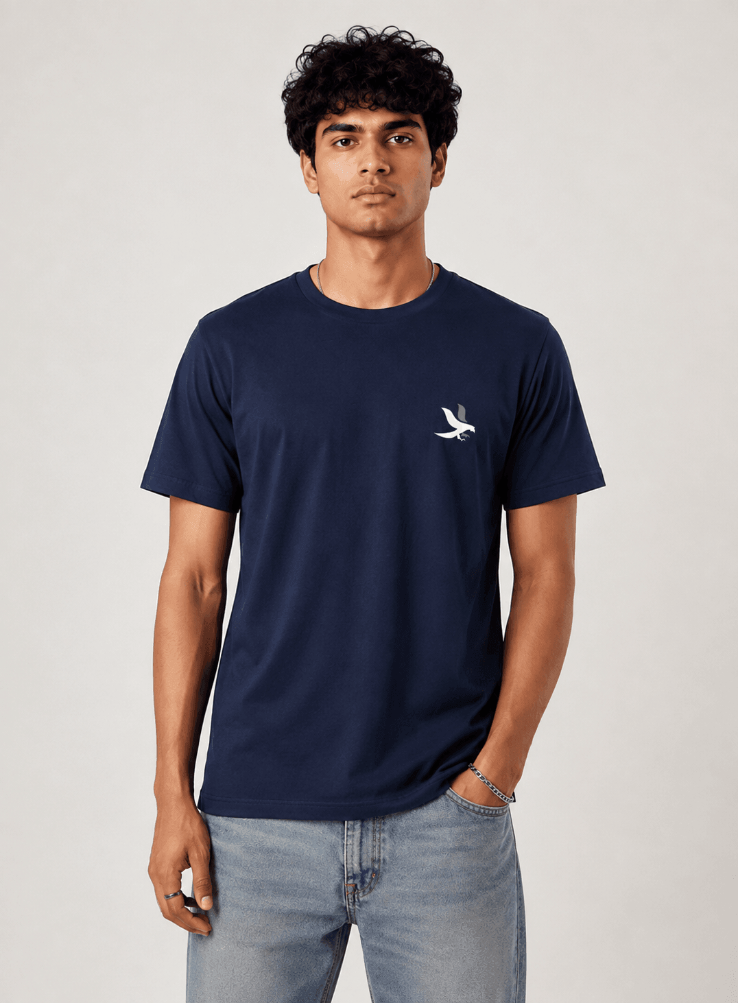 Model wearing the Navy Blue Signature Eagle regular-fit T-shirt, front view with the eagle chest mark