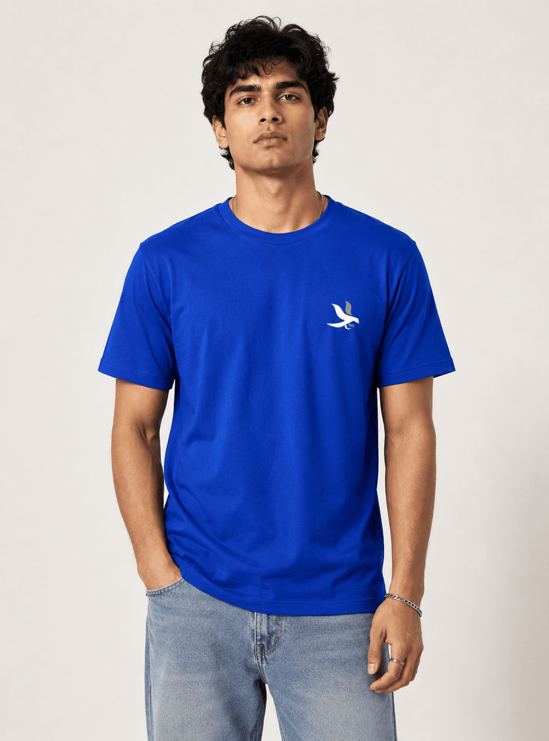 Model wearing the Royal Blue Signature Eagle regular-fit T-shirt, front view with the eagle chest mark